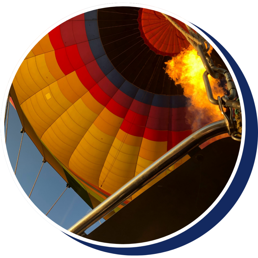 fire going into a hot air balloon at sunseet